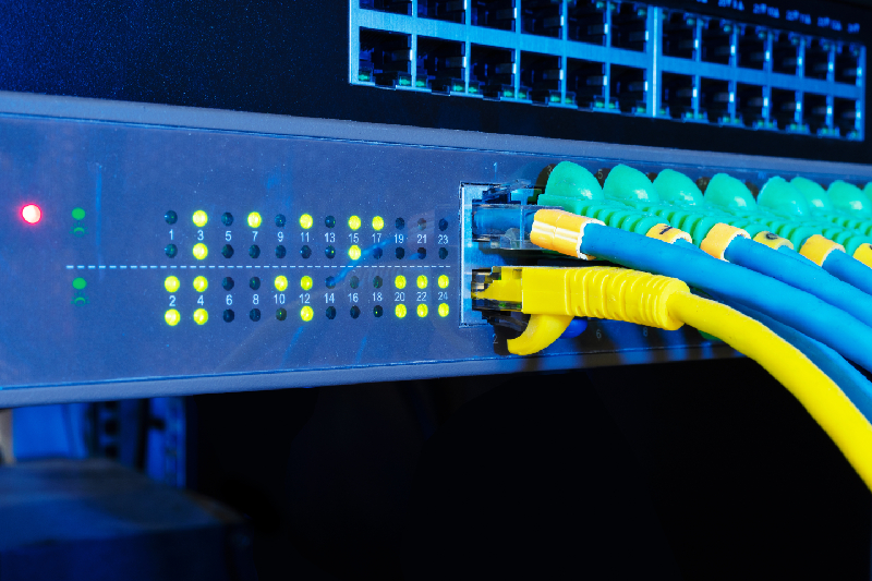 Close-up of an HDMI Transmitter and Receiver (extender kit) connected over a single Cat6 network cable.