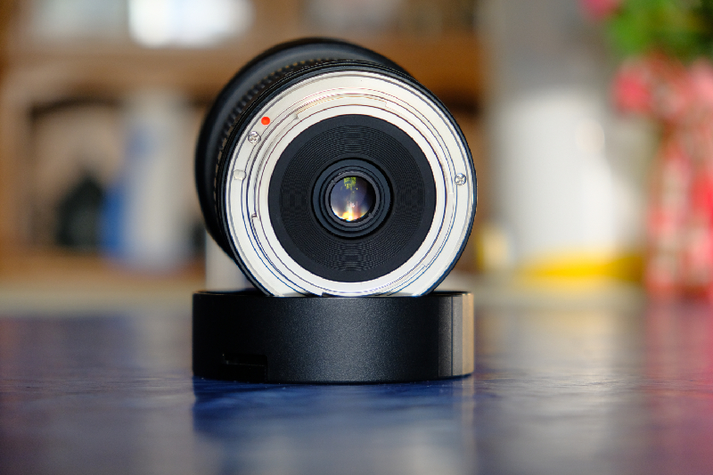 Close-up on a high-resolution HD video conferencing camera lens capable of capturing 4K video conferencing detail.
